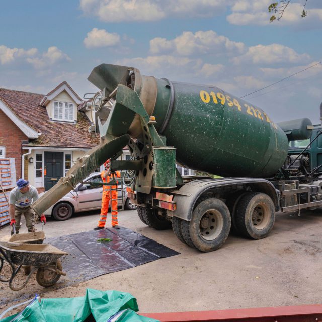 concrete poured into wheelbarrow